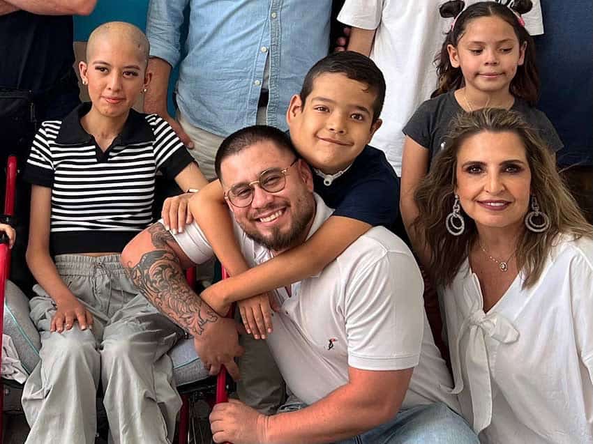 Adults and chuldren posing for a photo