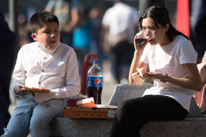 children drinking soda in Mexico
