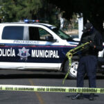 police car with do not cross tape in the foreground