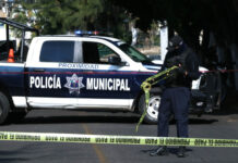 police car with do not cross tape in the foreground