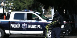 police car with do not cross tape in the foreground