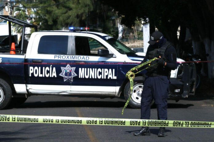 police car with do not cross tape in the foreground