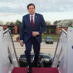 Marco Rubio boarding a plane