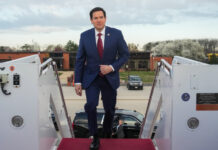 Marco Rubio boarding a plane