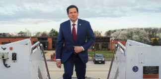 Marco Rubio boarding a plane