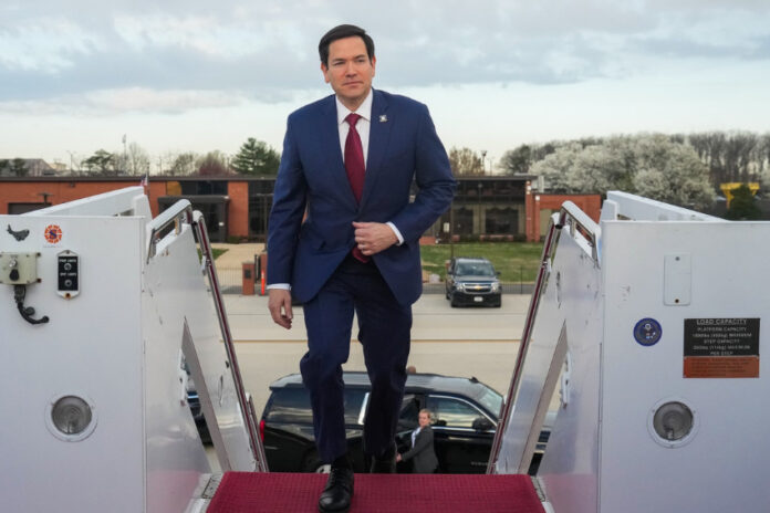 Marco Rubio boarding a plane