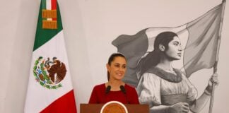 Sheinbaum at the podium of her press conference