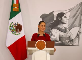 Sheinbaum at the podium of her press conference