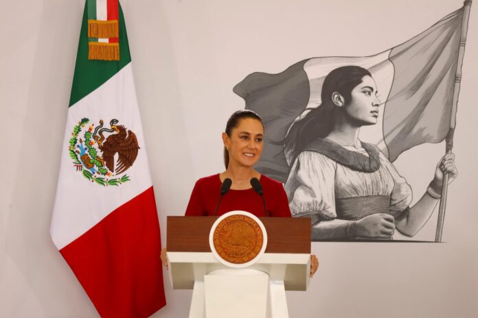 Sheinbaum at the podium of her press conference