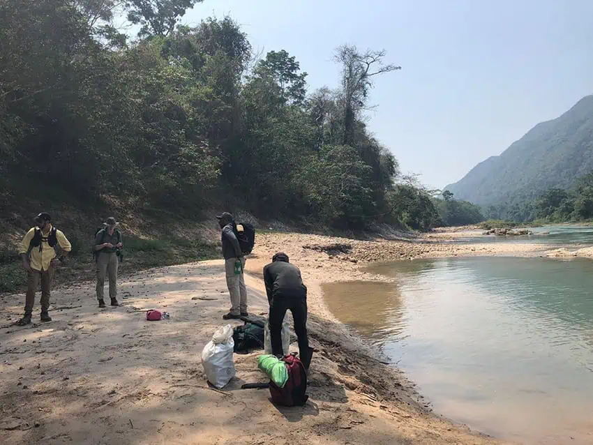 Researchers rest by a river in Chiapas