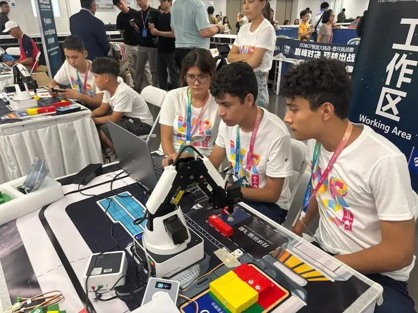 Karina Jaired Castellanos Hernández, Gabriel Enrique Ojeda Carrillo and Luis Fernando Quintana Ríos working on their project for the “DOBOT Intelligent Manufacturing Challenge — Moon Landing Challenge" at the 2025 World Robotic Contest in Beijing last week.
