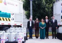 five people standing in a row