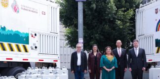 five people standing in a row