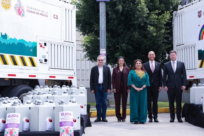 five people standing in a row