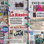 newspapers hanging up at a stand