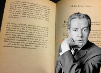 Juan Rulfo in front of a page of his book