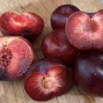 A pile of chopped and seeded plums