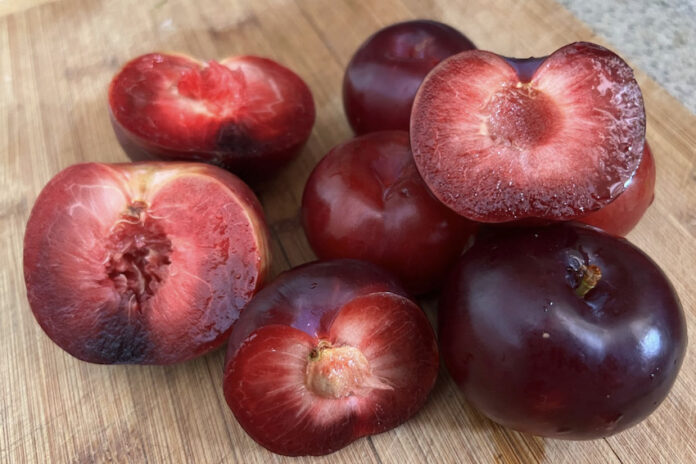 A pile of chopped and seeded plums