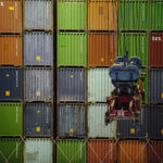 A wall of import/export shipping containers