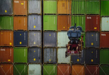 A wall of import/export shipping containers