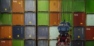 A wall of import/export shipping containers