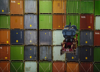 A wall of import/export shipping containers