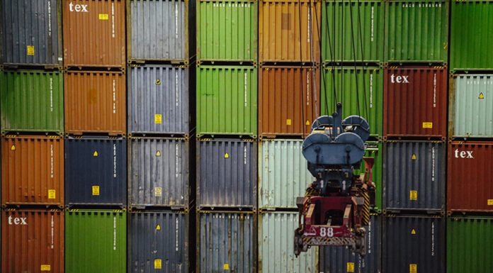A wall of import/export shipping containers