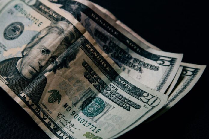 A stack of US dollar bills