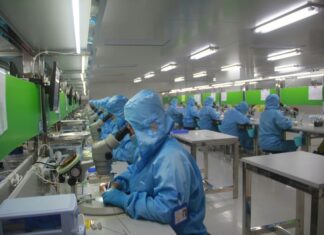 Employees at work in a drug manufacturing facility