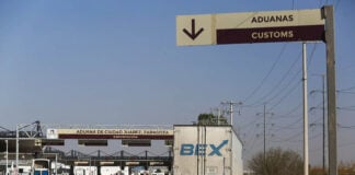 A semi trailer appraoches customs at a land border crossing