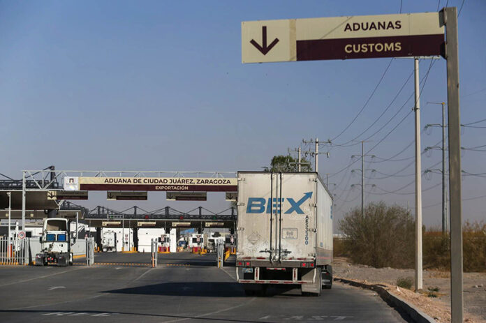 A semi trailer appraoches customs at a land border crossing