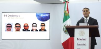 Omar García Harfuch announcing arrests made in a fuel smuggling ring