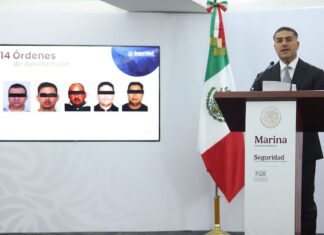 Omar García Harfuch announcing arrests made in a fuel smuggling ring