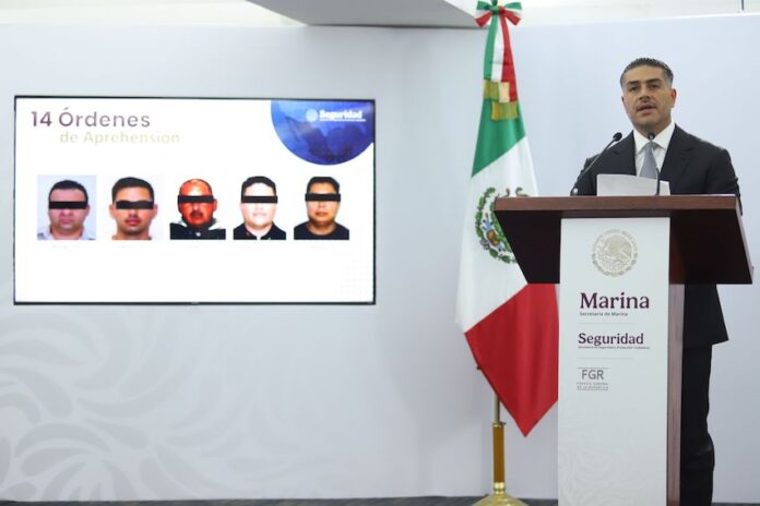Omar García Harfuch announcing arrests made in a fuel smuggling ring