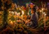 An elderly couple at a grave during Day of the Dead in Oaxaca