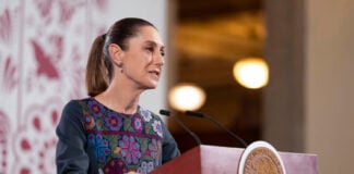 President Sheinbaum at the podium of her daily press conference