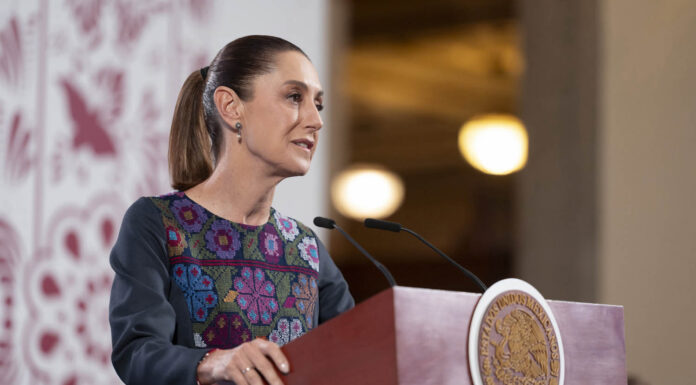 President Sheinbaum at the podium of her daily press conference