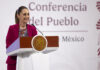 "Conferencia del Pueblo" reads a banner behind President Sheinbaum as she stands at the podium of her morning press conference