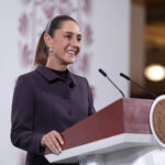 Sheinbaum at a press conference podium
