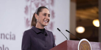 Sheinbaum at a press conference podium