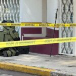 police officer neutralizes a grenade outside Morelia's INM