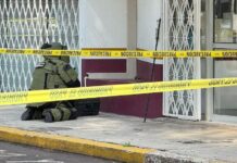 police officer neutralizes a grenade outside Morelia's INM