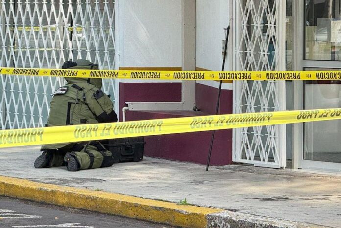 police officer neutralizes a grenade outside Morelia's INM