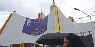 luz del mundo church with poster of Naason Joaquín García