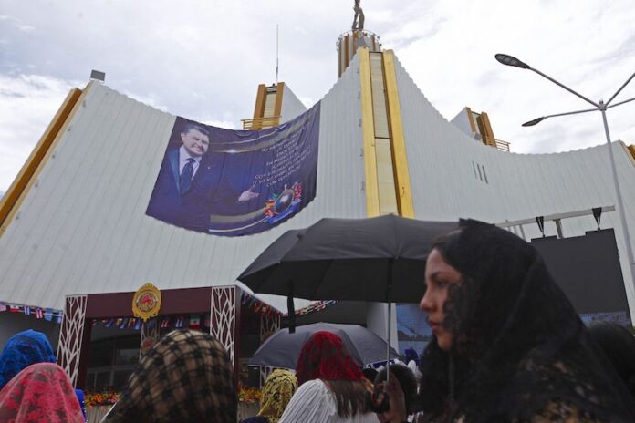 luz del mundo church with poster of Naason Joaquín García