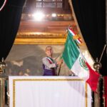 Sheinbaum waving the Mexican flag from the National Palace during the annual Grito de Independencia