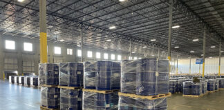 Barrels of precursor chemicals in a warehouse