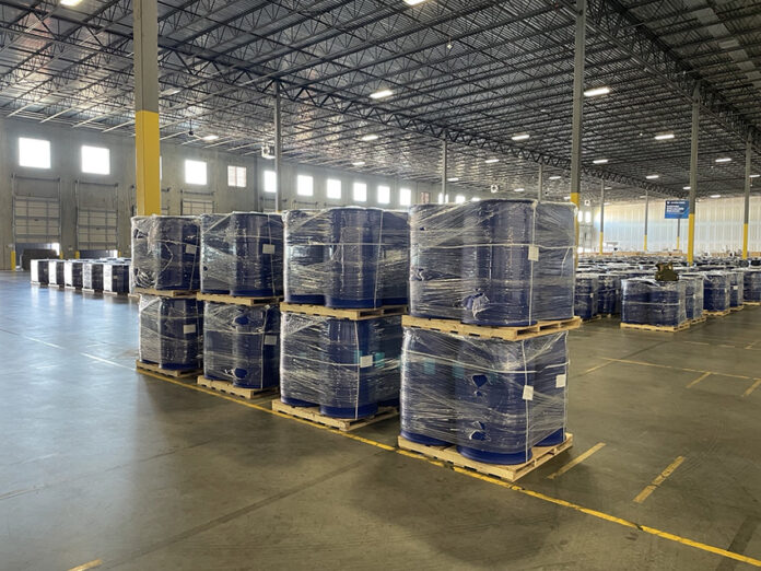 Barrels of precursor chemicals in a warehouse
