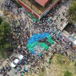 aerial view of blue trash bags in street