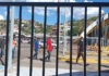 Brown men walk through the US-Mexico border in Nogales